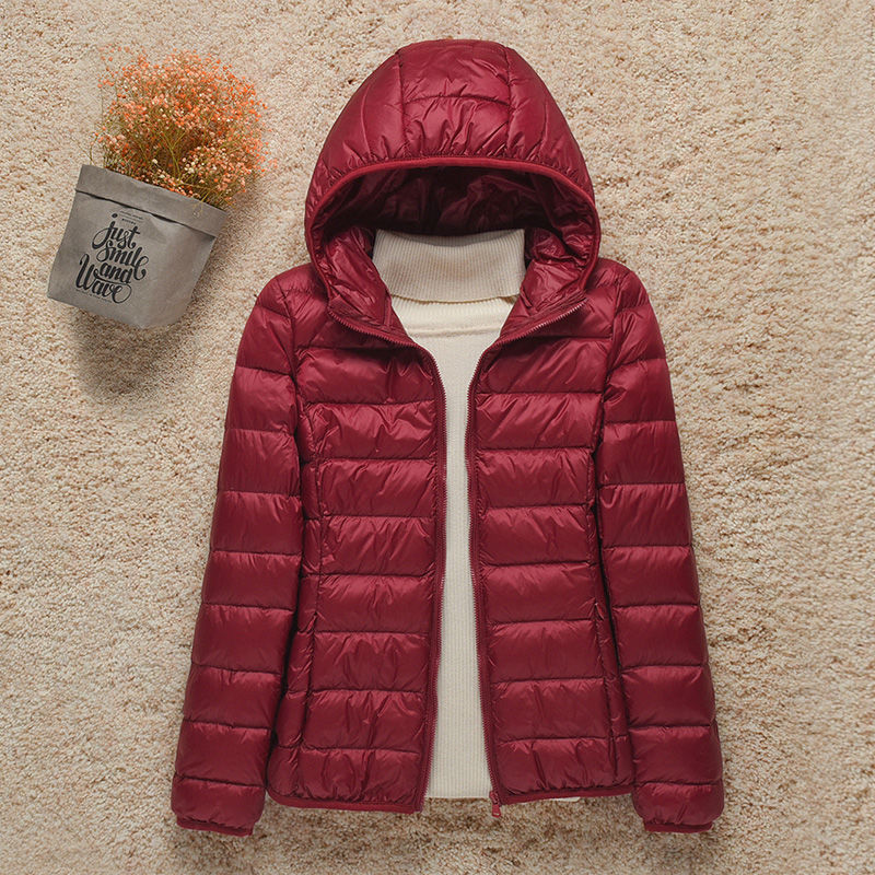 Women's hooded puffer jacket warm lightweight outdoor style with attached hood for cold weather