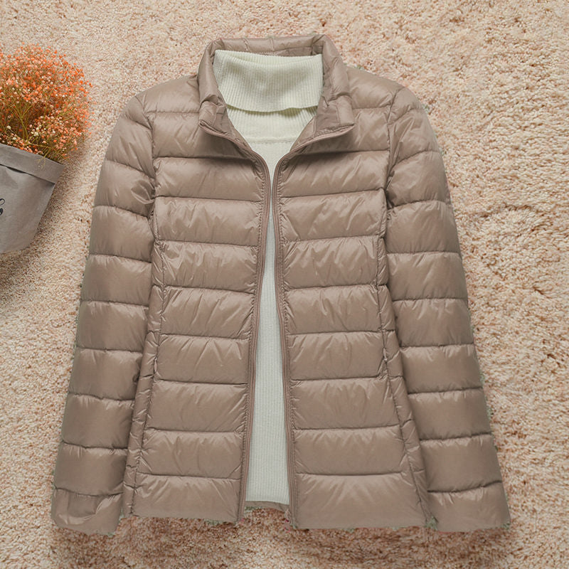 Women's hooded puffer jacket lightweight warm cozy silhouette for outdoor cold-weather adventures