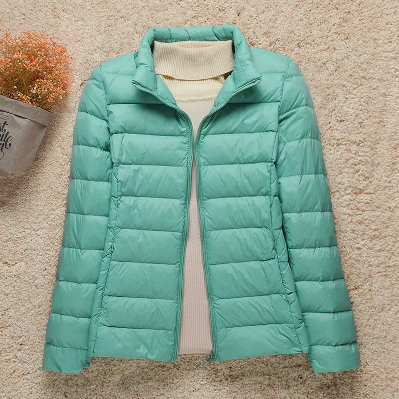 Women's hooded puffer jacket lightweight warm cozy stylish outdoor adventure cold weather layer