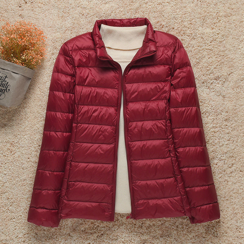 Women's hooded puffer jacket lightweight warm cozy stylish outdoor adventure attached hood