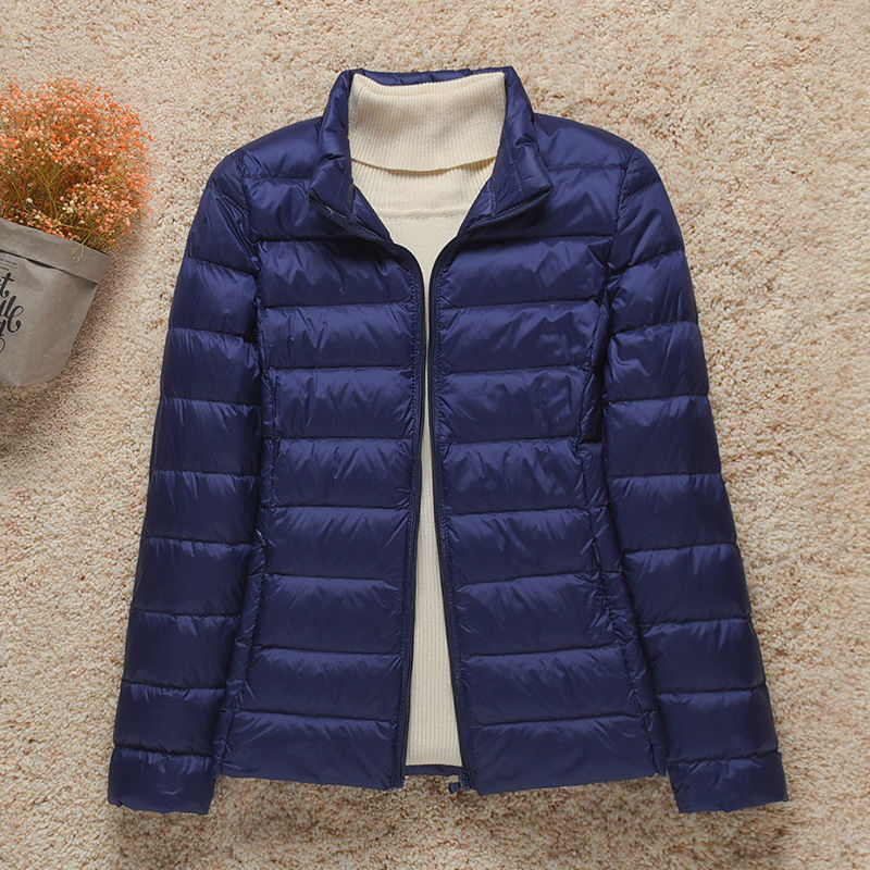 Women's hooded puffer jacket lightweight warm cozy stylish outdoor adventure cold weather layer