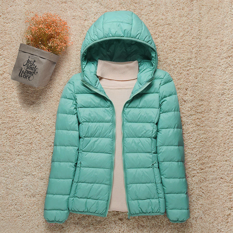 Women's hooded puffer jacket warm lightweight cozy silhouette for outdoor cold-weather adventures