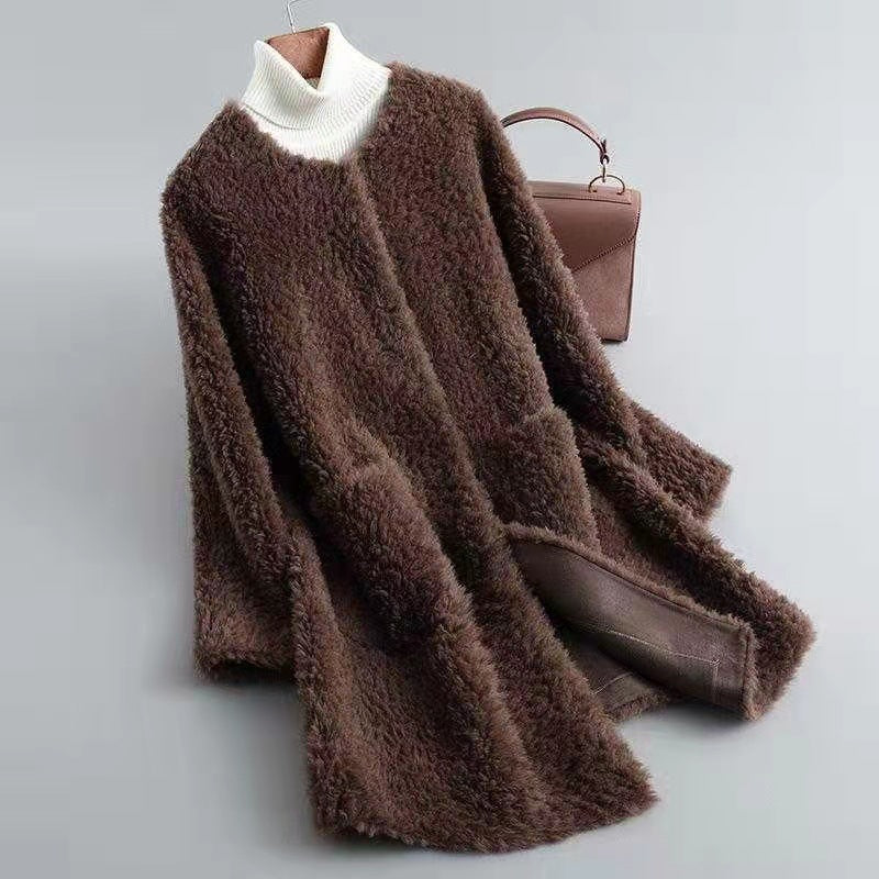 Women's oversized shaggy wool knee-length coat in neutral tone with open front relaxed silhouette