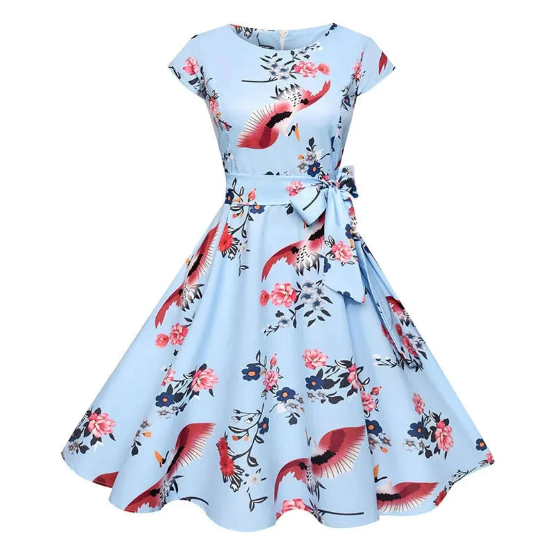 Women's 1950s vintage swing dress cap sleeve fit-and-flare silhouette floral polka dot bird print