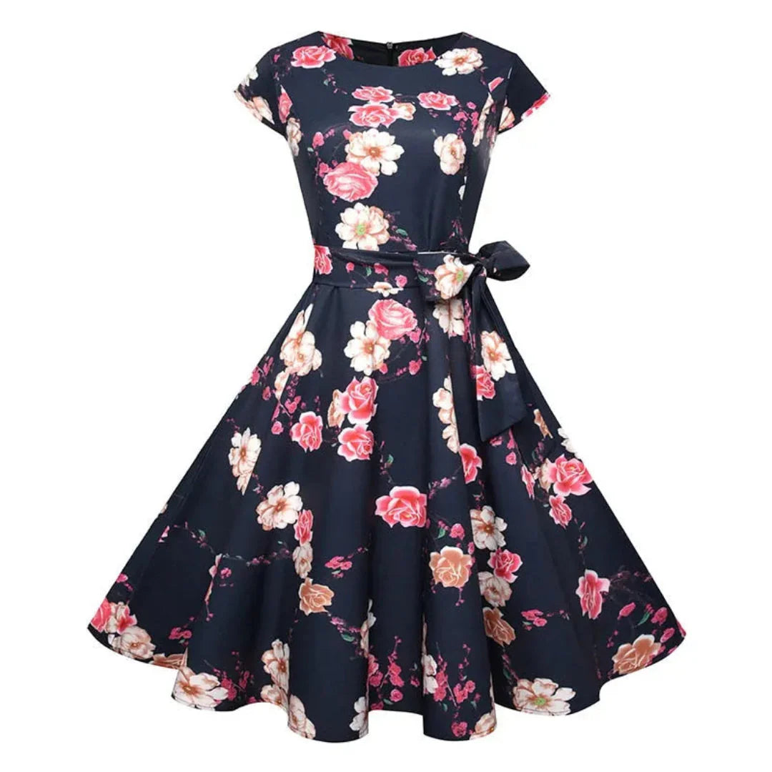 Women's 1950s vintage swing dress cap sleeve fit-and-flare silhouette floral polka dot bird print