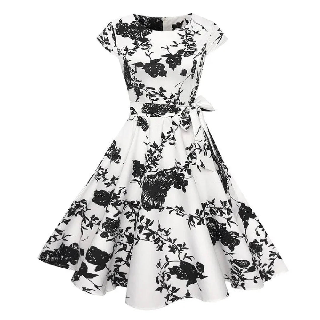 Women's 1950s vintage swing dress cap sleeve fit-and-flare silhouette floral polka dot bird print