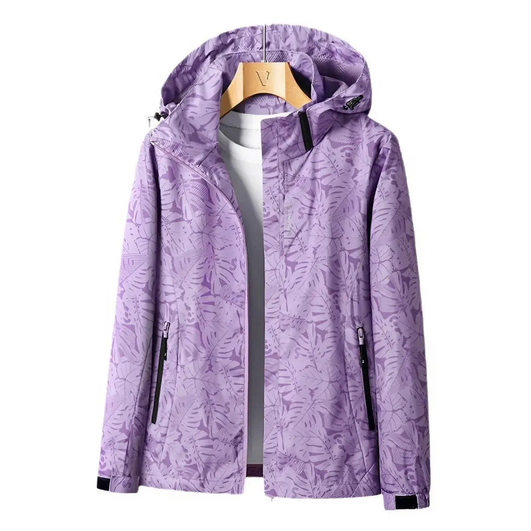 Women's lightweight waterproof jacket with adjustable hood, slim feminine fit, secure zip pockets