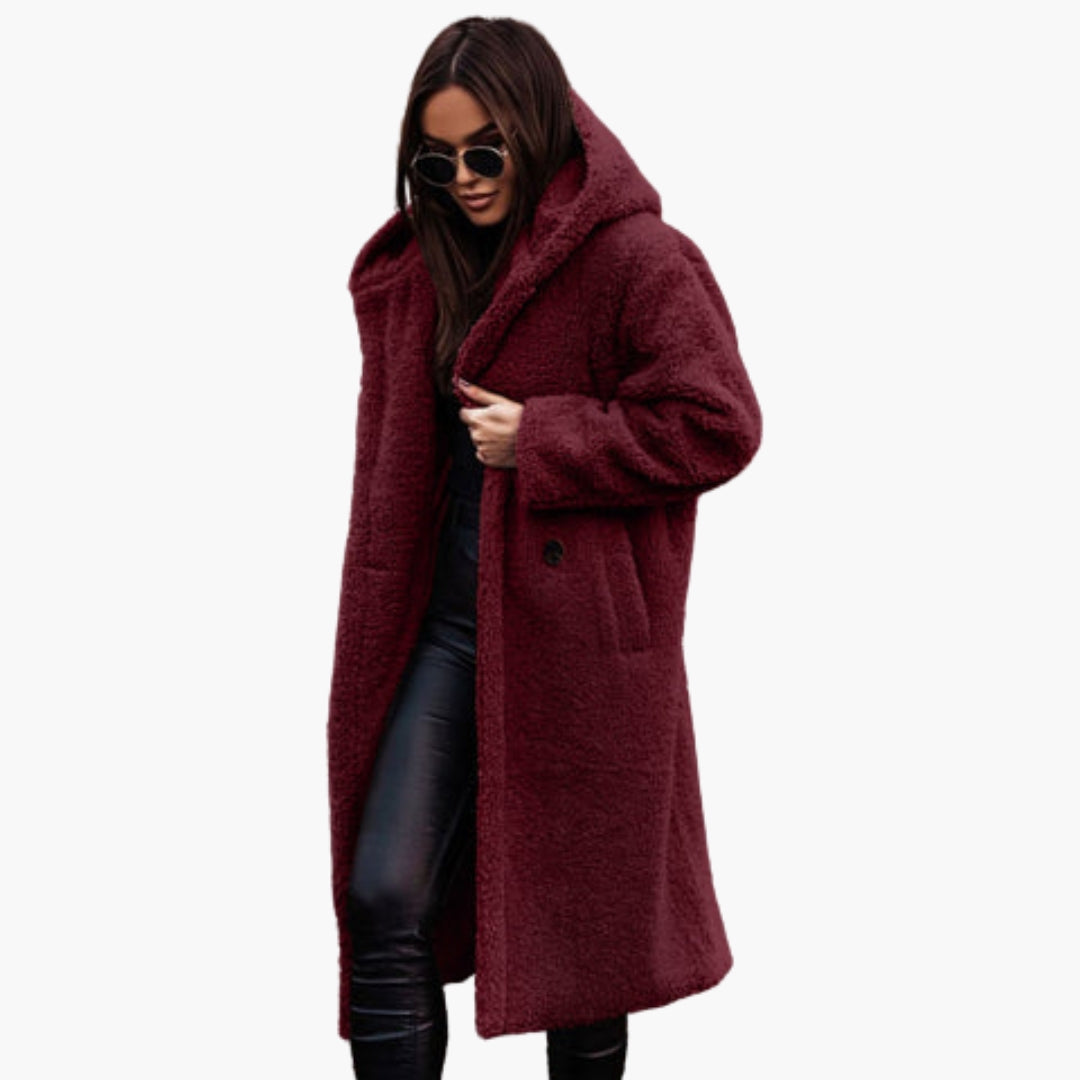 Women's long teddy coat with hood, plush exterior, button closure, cozy warmth in neutral tones