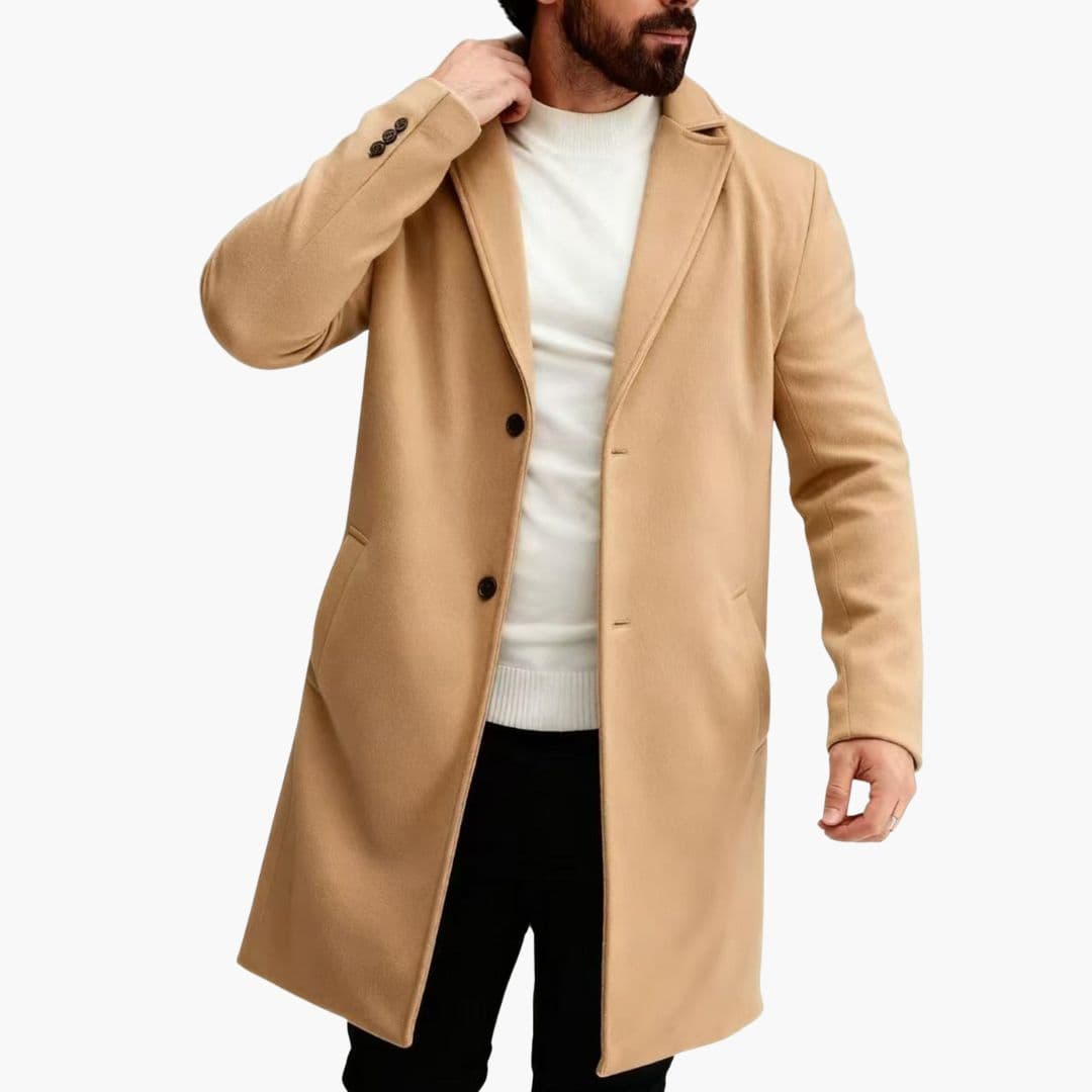 Men's long winter coat with notched collar, vertical button front closure, and welt pockets for everyday wear