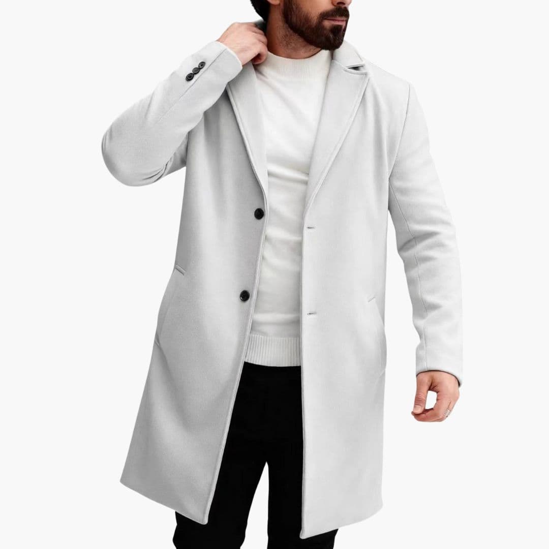 Men's long winter coat with notched collar, vertical button closure, and front welt pockets for timeless style