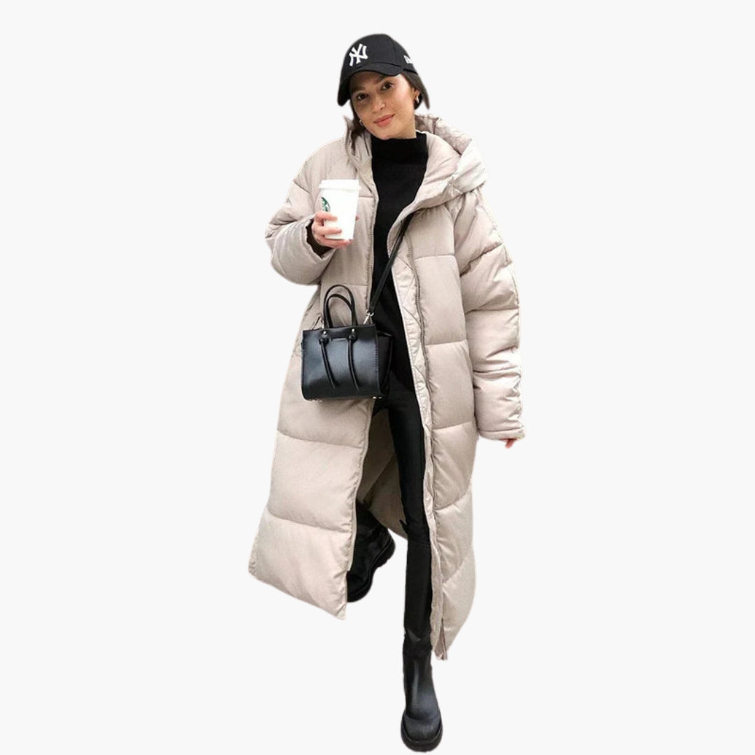 Women's long quilted hooded coat with front zipper, side pockets, knee-length, all-weather warmth