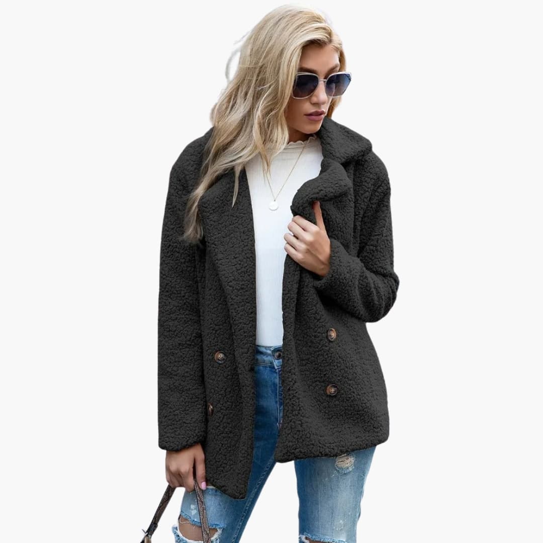 Women's structured mid-length winter coat with lapel collar, button closure, and side pockets