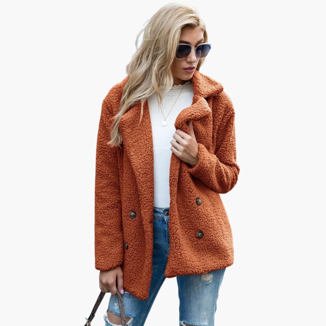 Women's structured mid-length winter coat with lapel collar, button closure, and side pockets