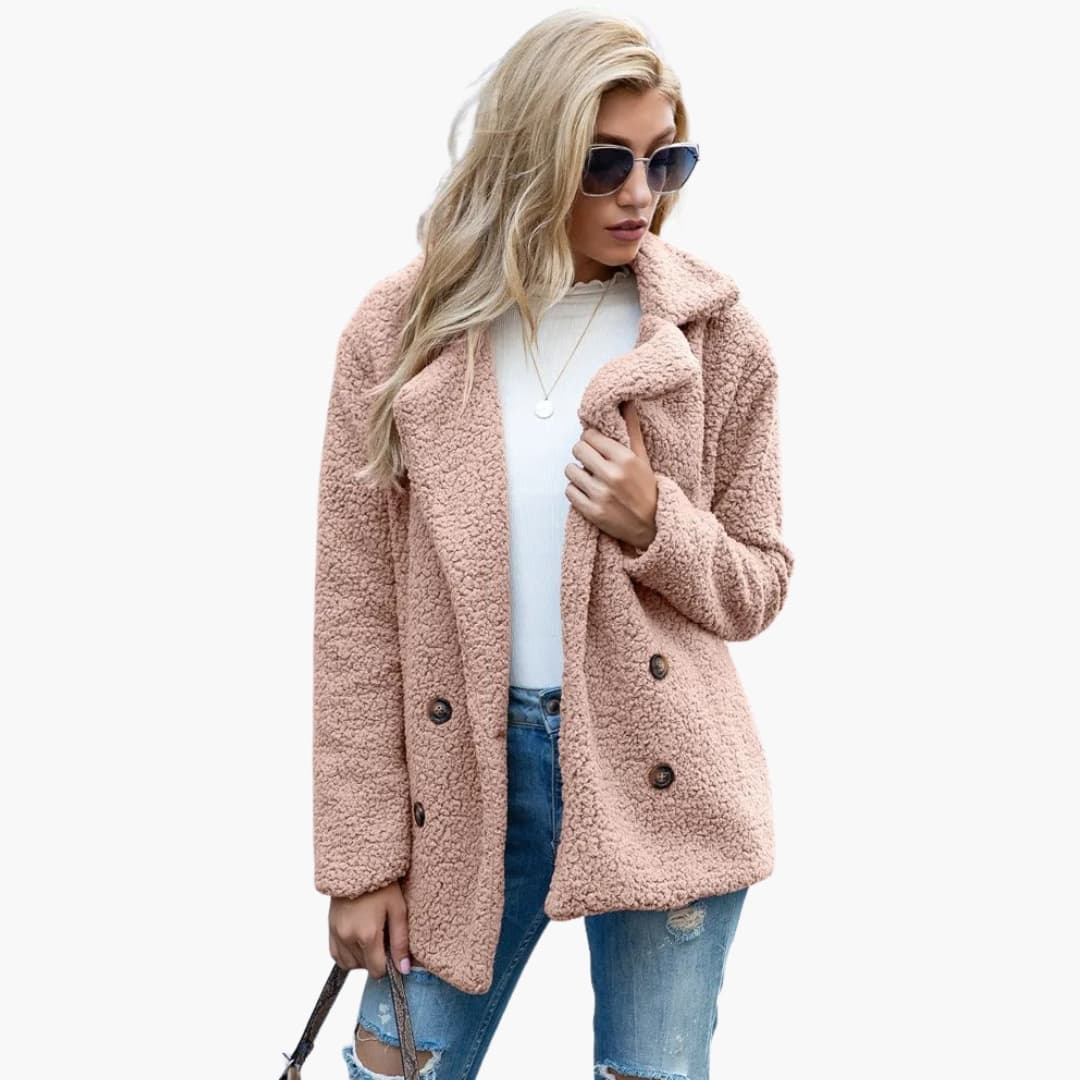 Women's structured mid-length winter coat with lapel collar, button closure, side pockets, chic layerable style