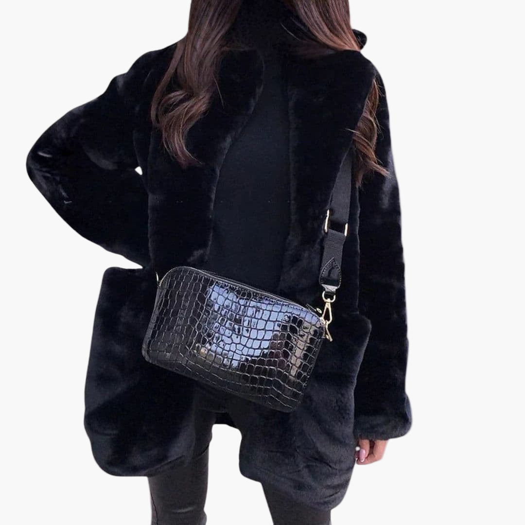 Women's mid-length plush coat with textured surface, structured silhouette, and discreet hook closure