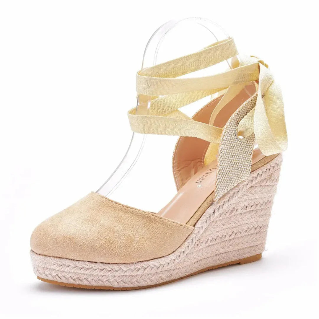 Women's closed-toe wedge espadrilles with crisscross lace-up ankle straps and rope-wrapped platform