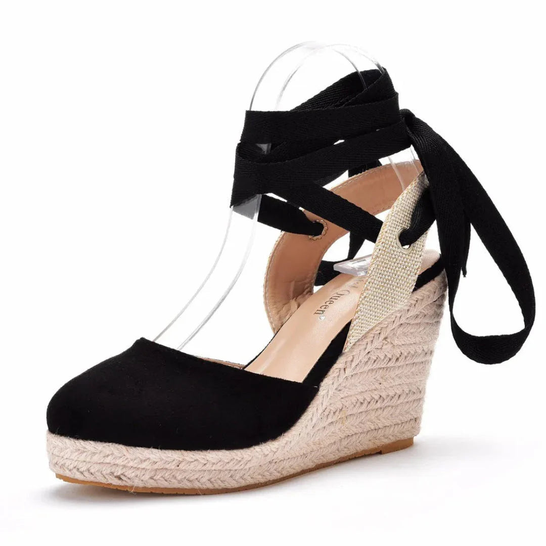 Women's closed-toe wedge espadrilles with crisscross lace-up ankle straps and rope-wrapped platform