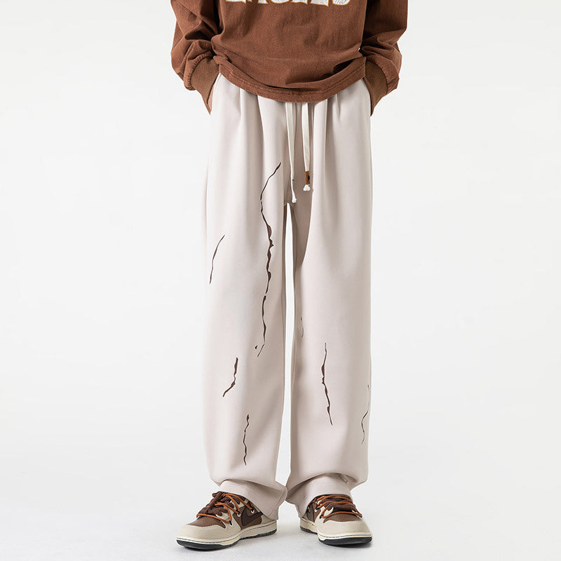 Marcello black streetwear joggers relaxed fit bold abstract paint-drip print avant-garde style
