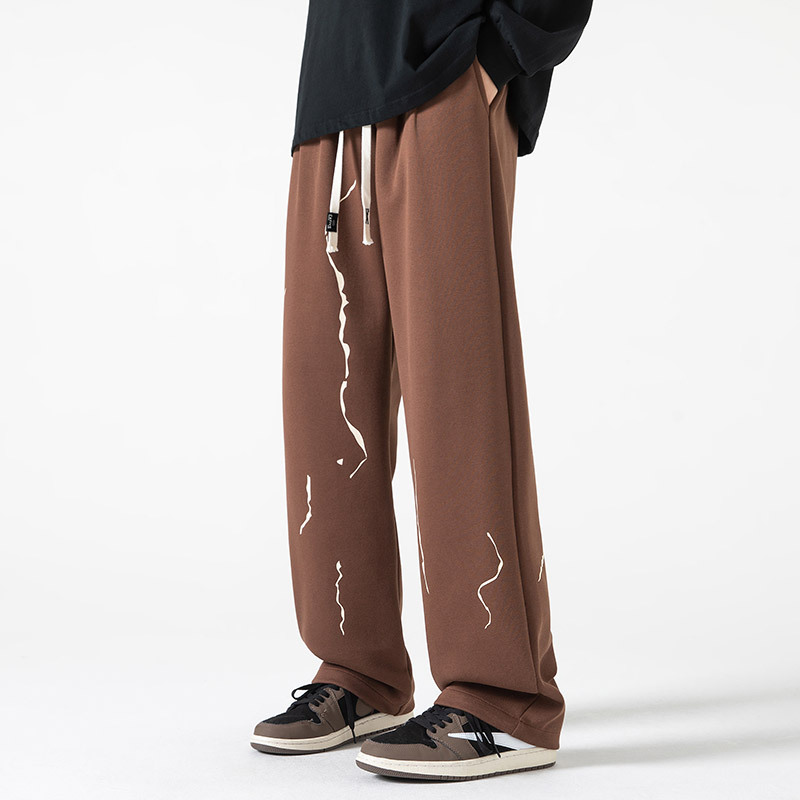 Black streetwear joggers relaxed fit abstract paint-drip print avant-garde casual athletic pants