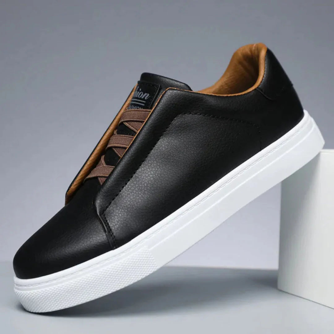 Men's white minimalist leather sneakers with padded collar, sleek low-profile silhouette and premium finish