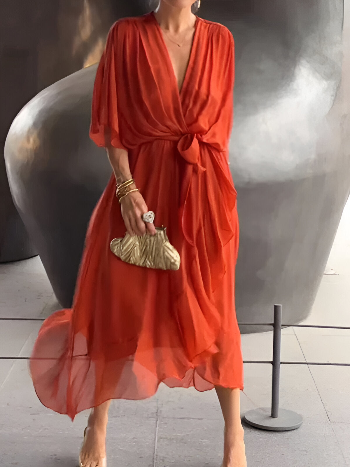Gabriella flowy midi dress deep-V neckline cinched belted waist elegant day-to-night silhouette