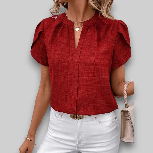 Women's lightweight woven blouse with petal flutter sleeves and pleated notch neckline