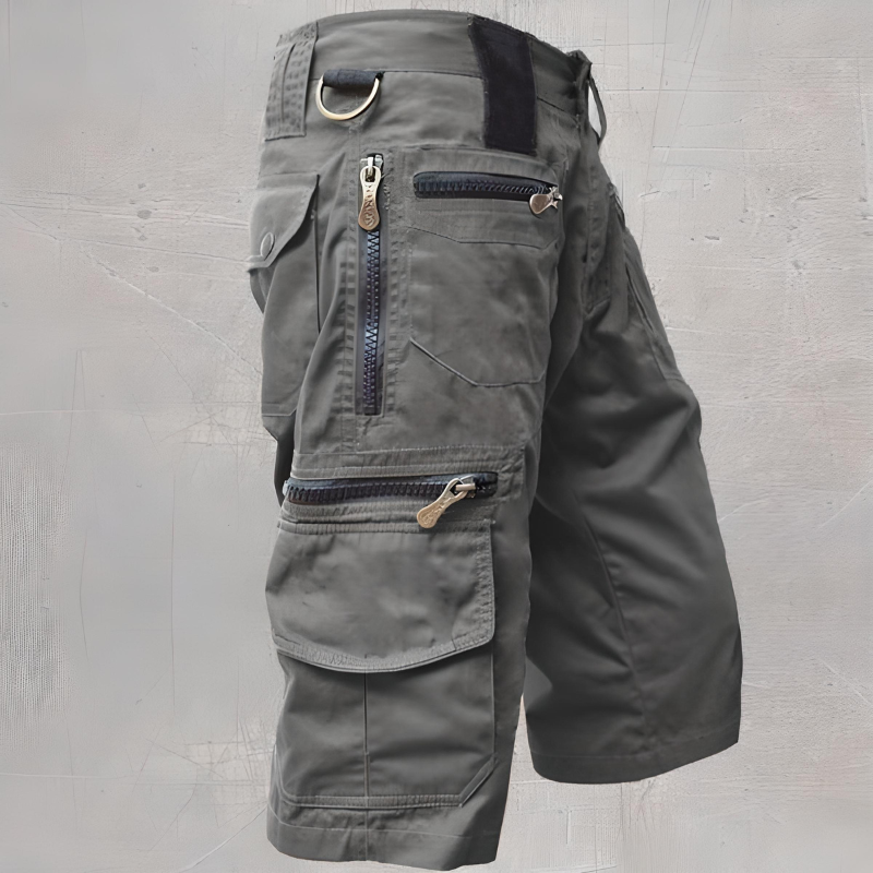 Men's tactical cargo shorts in olive green, relaxed fit, with deep reinforced pockets for outdoor use
