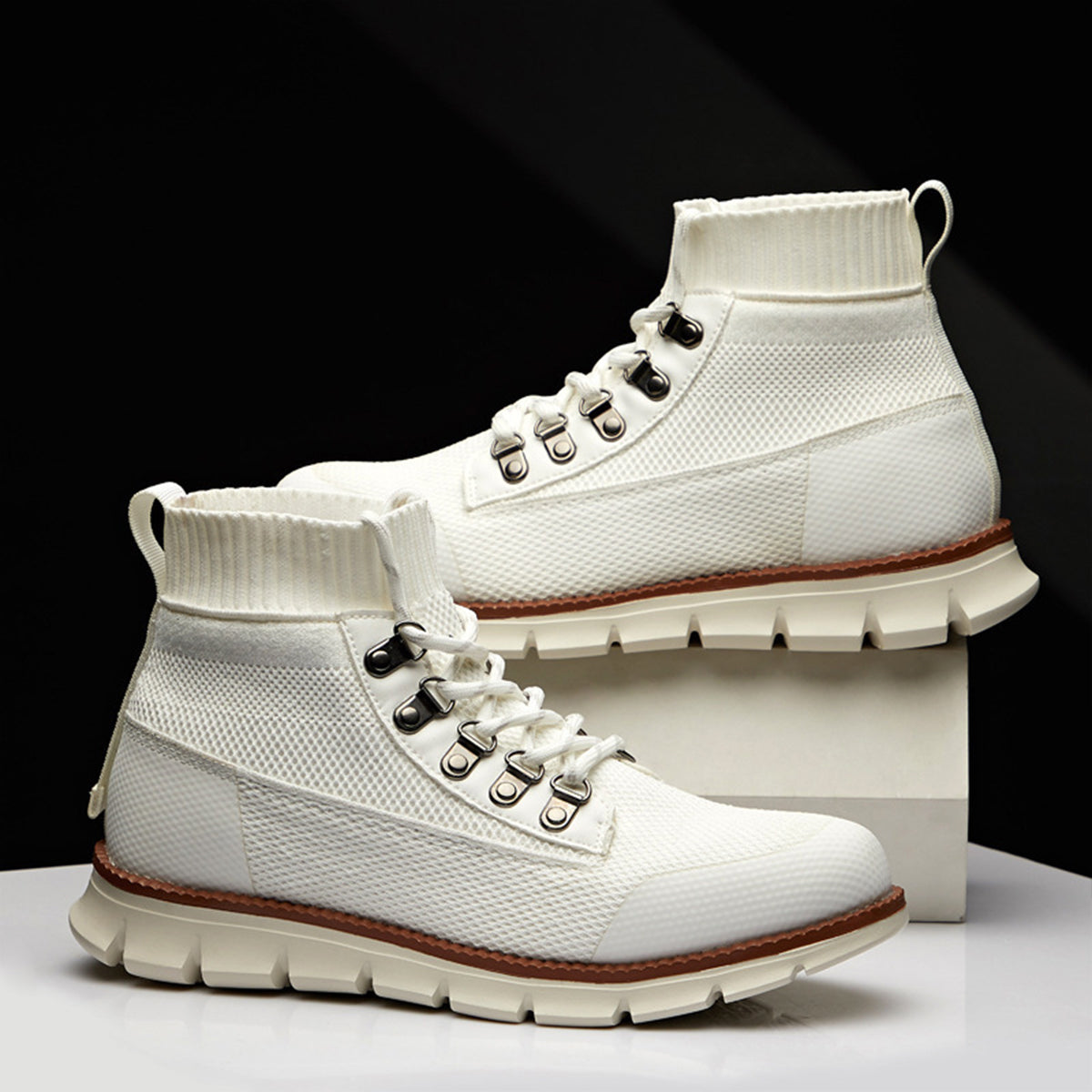 Men's brown ankle lace-up boots with ribbed cuff, rugged lug sole, and standard everyday casual fit