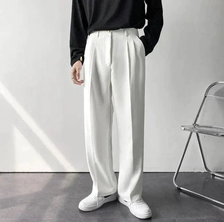 Matte wide-leg tailored pleat pants in neutral tones, relaxed silhouette for modern minimalist professionals