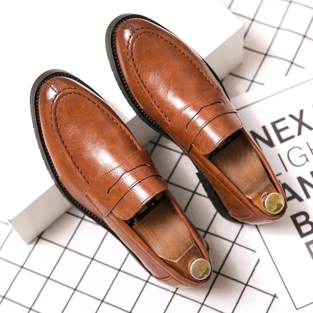 Men's brown handcrafted leather penny loafers with lightweight sole and refined classic silhouette