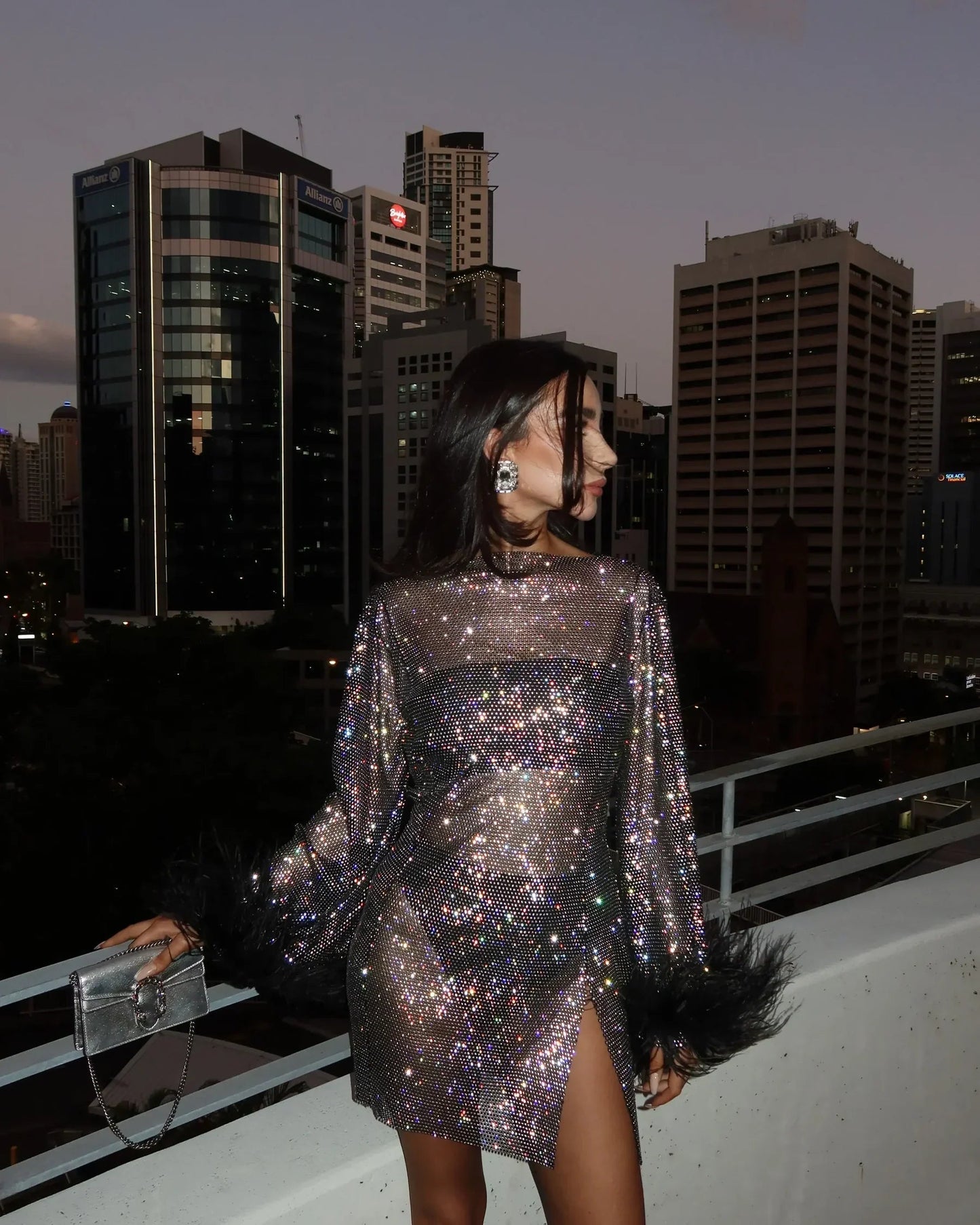 Silver shimmer mini cocktail dress with feather cuffs, sleek silhouette for glamorous night out