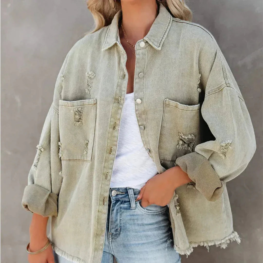 Women's oversized distressed denim jacket with frayed hem detail and classic button-up closure