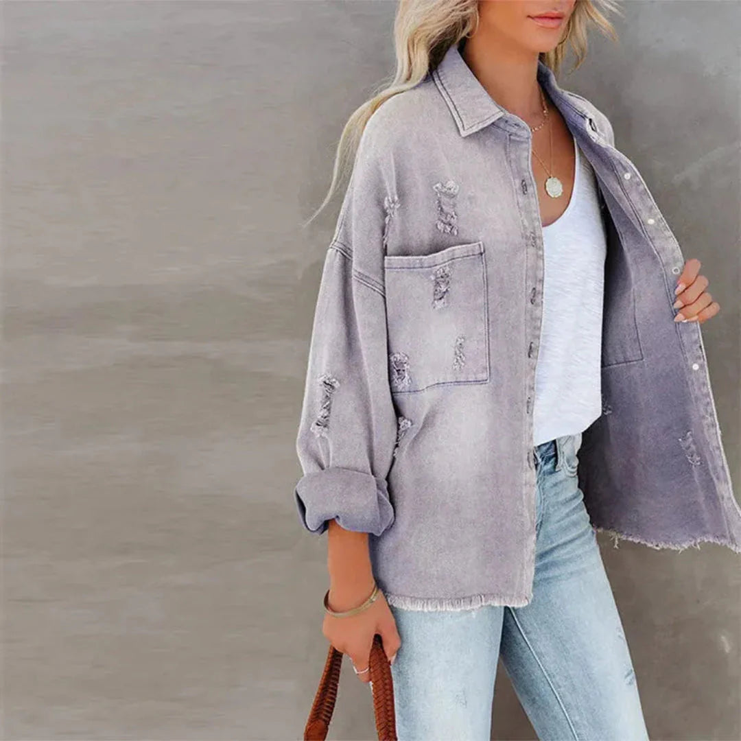 Women's oversized distressed denim jacket with frayed hem detail in premium soft cotton blend