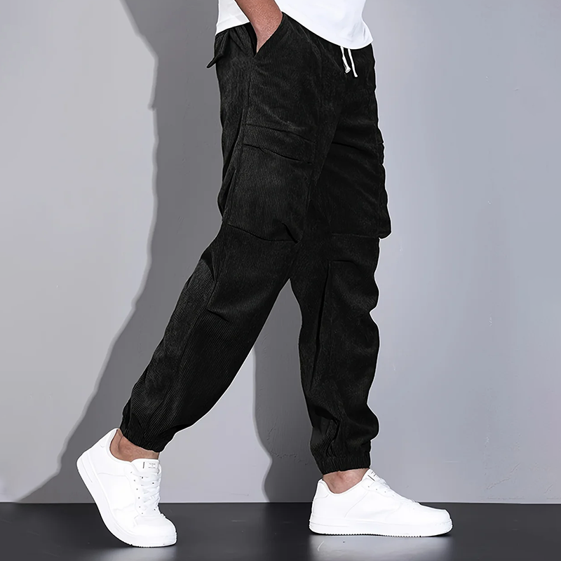 Men's brown corduroy cargo jogger pants with drawstring waist and utility pockets