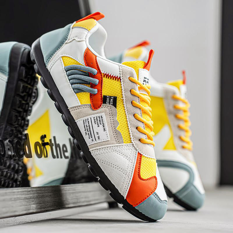 Men's multitone sneakers with layered stitch design, breathable mesh upper and PU leather details
