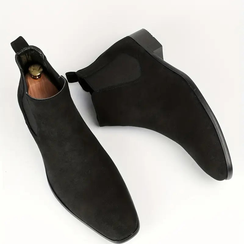 Men's black Chelsea boots sleek slip-on ankle style with elastic side panels and cushioned interior