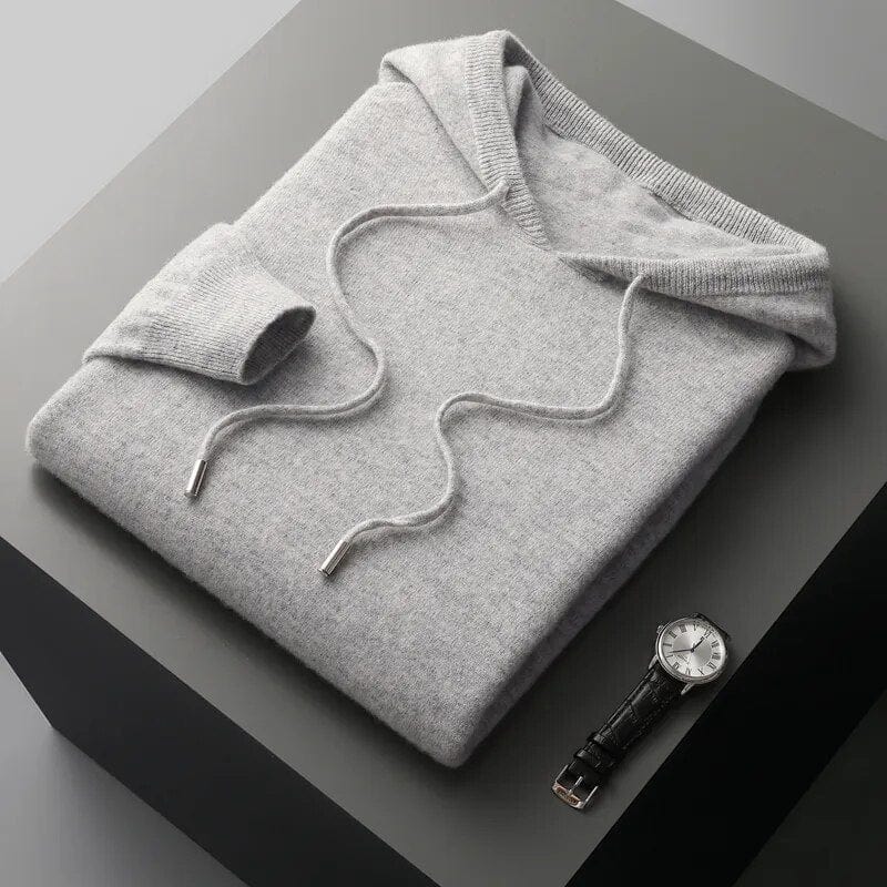 Men's gray minimalist knit pullover hoodie with structured drawstring hood and ribbed cuffs