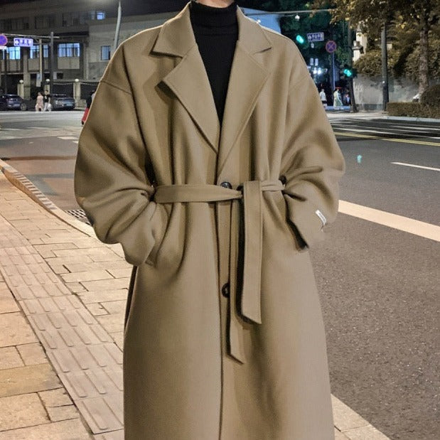 Men's long belted wool overcoat camel structured shoulders wide lapels wrap closure tailored fit
