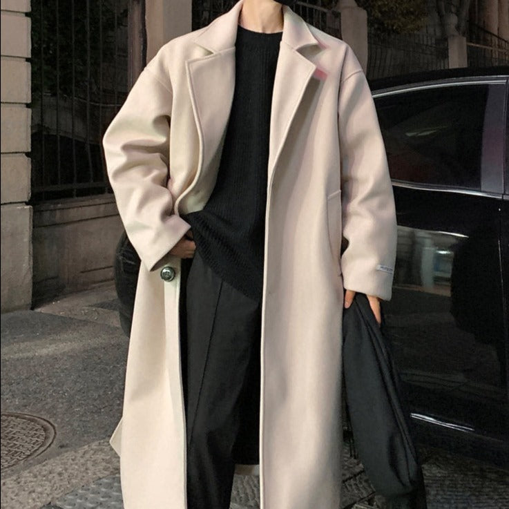 Men's long belted wool overcoat camel structured shoulders wide lapels wrap closure tailored fit