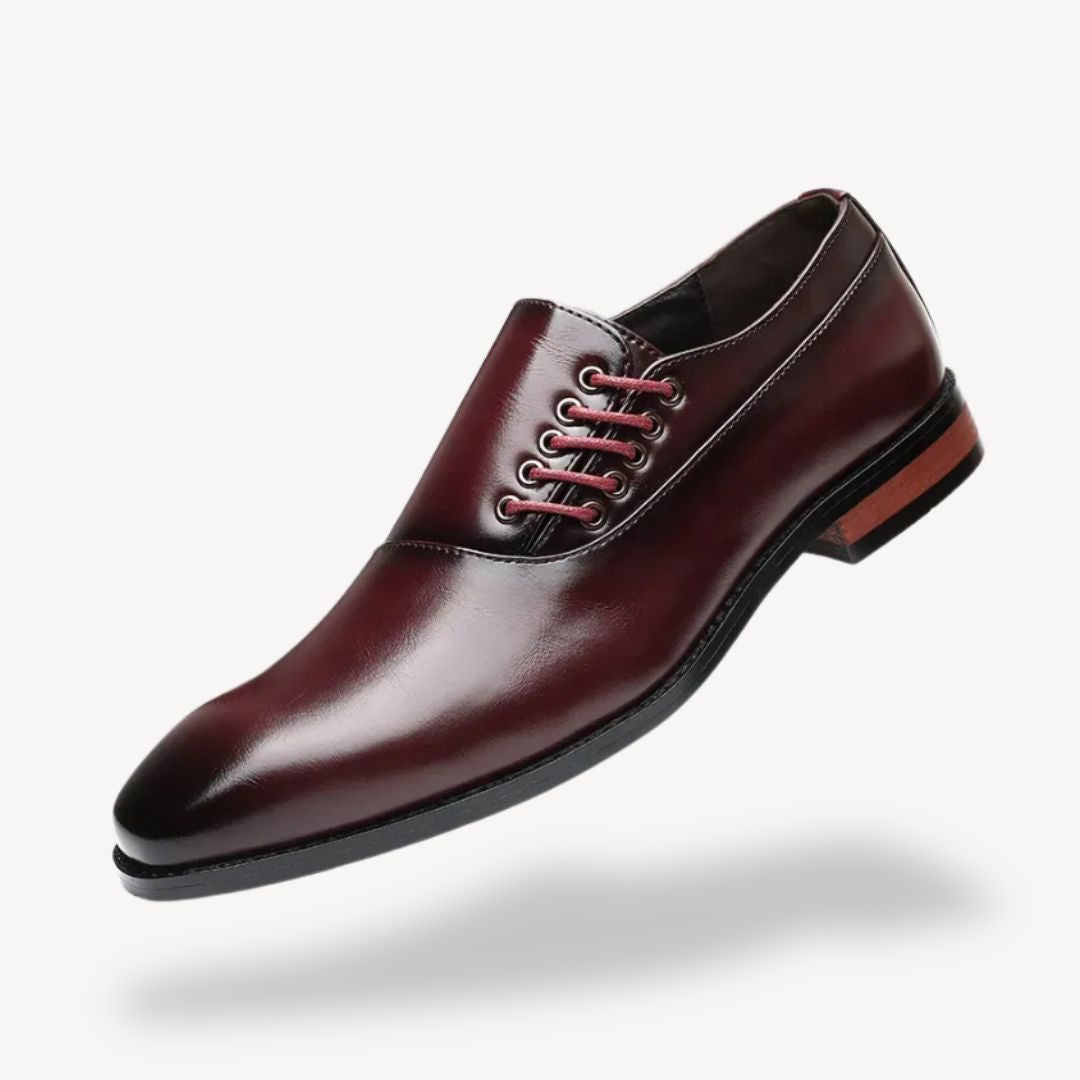 Men's black pointed-toe Oxford dress shoes with side lace-up closure for formal professional wear