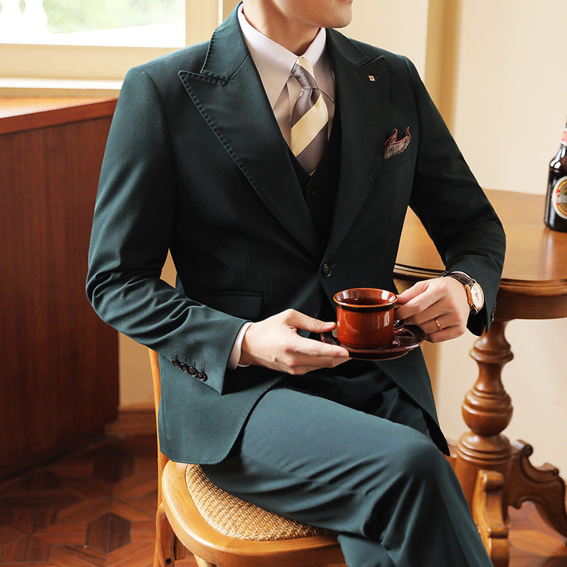 Men's slim tailored three-piece suit in classic tone, notch-lapel blazer, waistcoat, and trousers for weddings