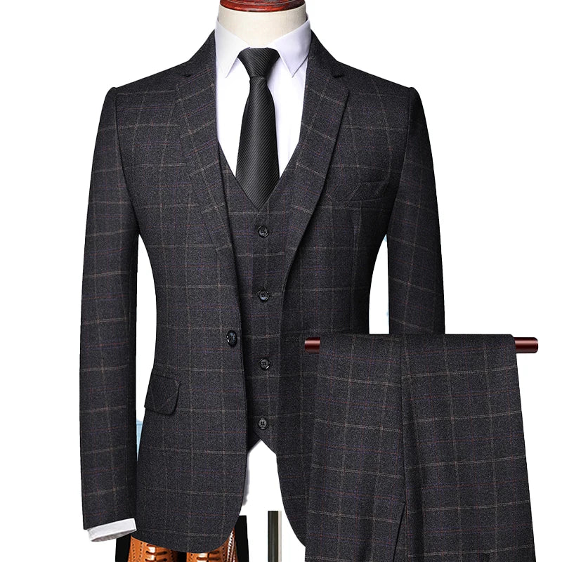 Men's classic three-piece suit in heritage British style with sharp blazer, waistcoat, and tailored trousers