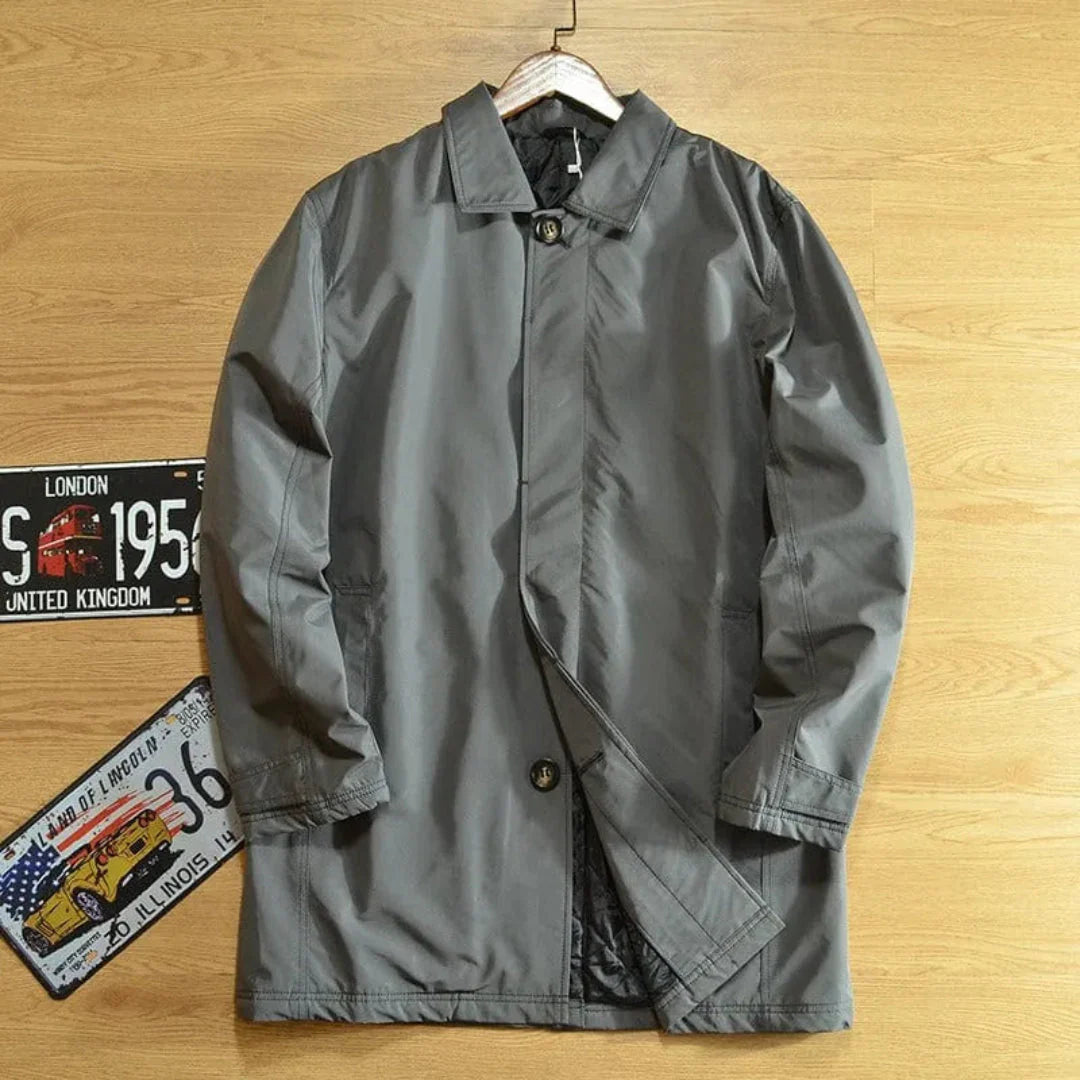Men's dark tailored weatherproof overcoat with classic silhouette and durable weather-resistant finish