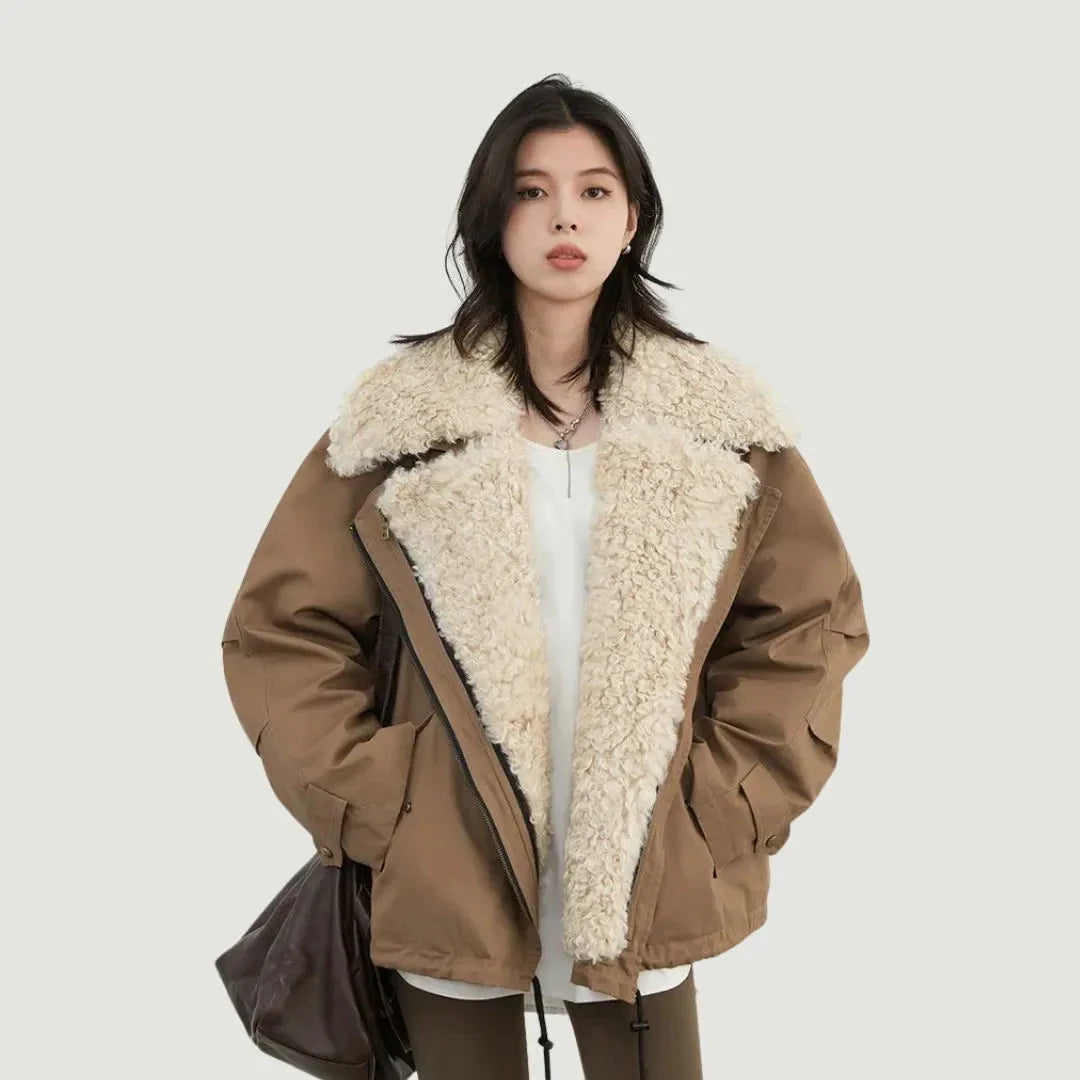 Women's oversized puffer bomber jacket with fleece lining, utility details, and street-ready silhouette