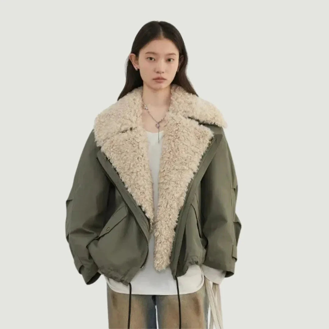 Women's oversized black puffer bomber jacket with plush fleece lining and utility details