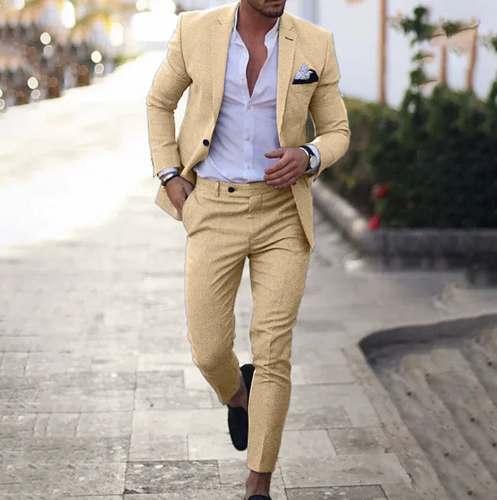 Navy blue men's tailored two-piece blazer and trousers set with structured slim-fit silhouette