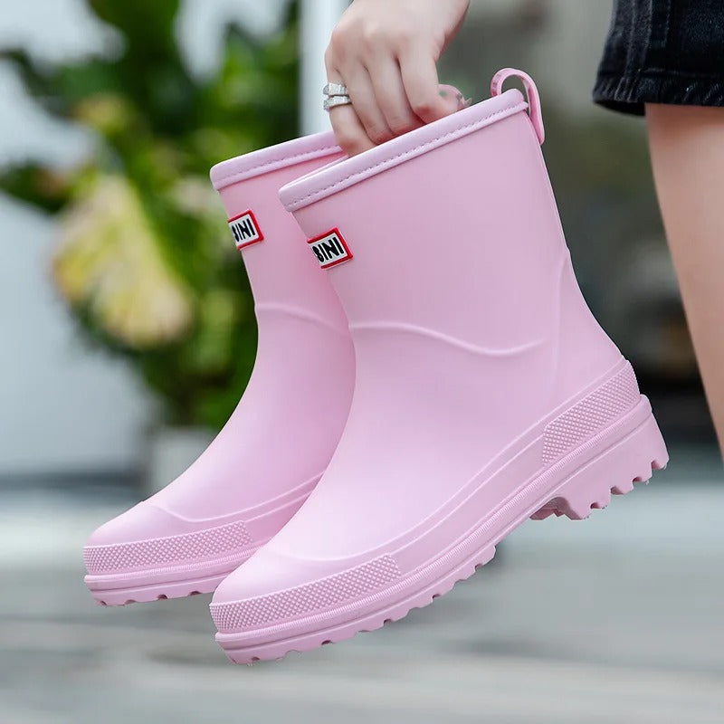 Women's mid-cut waterproof PVC rain boots with anti-slip rubber sole, sleek casual style for all-weather wear