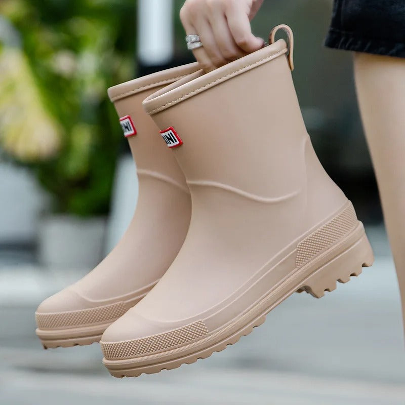 Women's mid-cut waterproof PVC rain boots with anti-slip rubber sole for all-weather protection