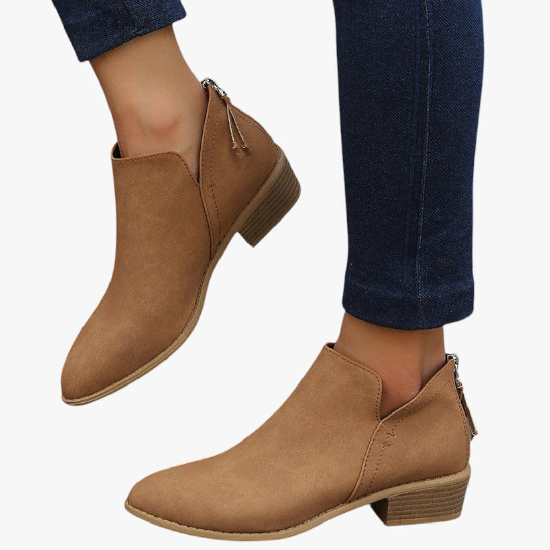 Women's suede ankle boots in neutral tone, low heel, side zipper closure, chic everyday style