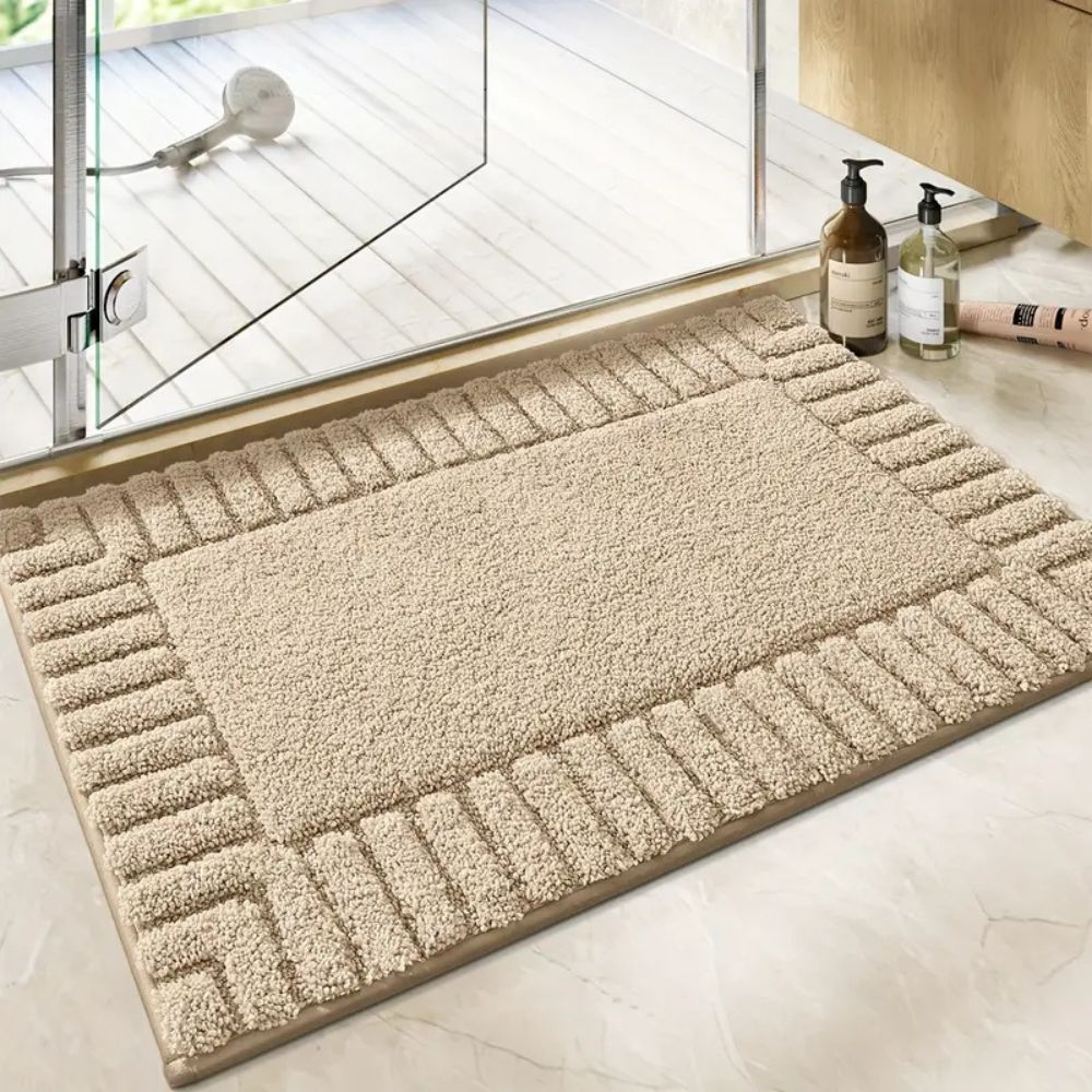 Minimalist plush cotton bath rug with non-slip backing, soft absorbent surface for modern bathrooms